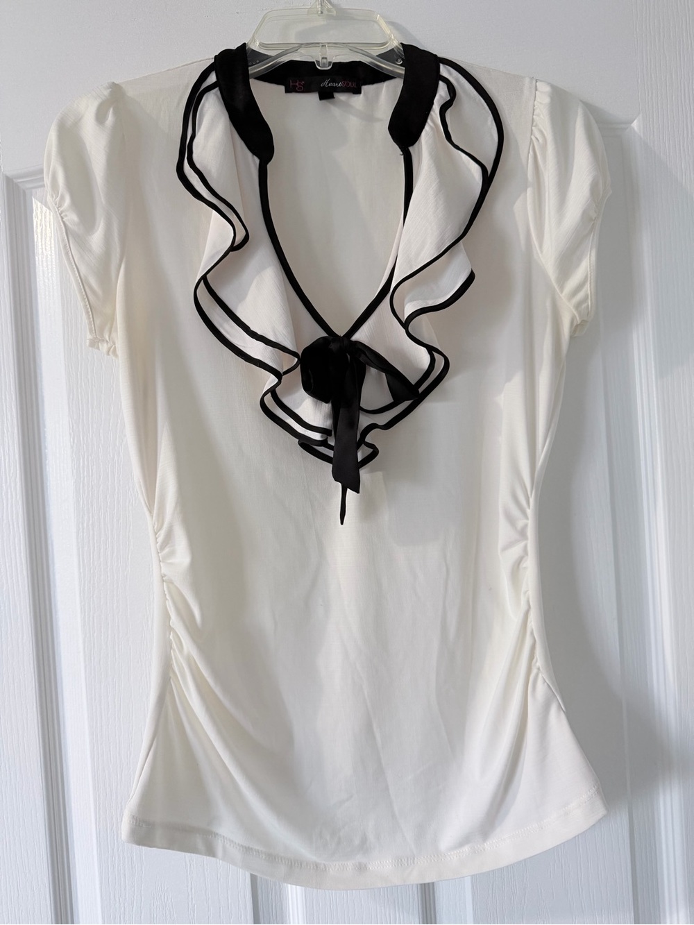{HeartSoul} White Short-Sleeve Ruffle Deep V-Neck Blouse with Black Trim & Bow